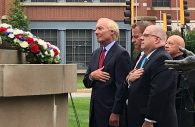 Maryland Gov. Larry Hogan, Annapolis Mayor Gavin Buckley and Maryland Comptroller Peter Franchot stand for a moment of silence before the Maryland Fire-Rescue Memorial during a wreath-laying ceremony commemorating the 17th anniversary of the Sept. 11, 2001, terrorist attacks on Sept. 11, 2018, in Annapolis, Maryland. (Photo by Brooks DuBose/Capital News Service)