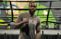 Professional boxer and entrepreneur, Kwame Ritter, poses in front of a boxing ring at his fitness club, Elite Boxing and Fitness Center. (Photo Courtesy of Elite Boxing